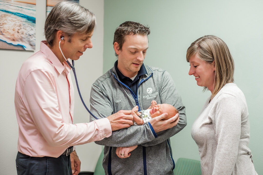 Dr.Morgan-with-parents-and-baby-at-appointment
